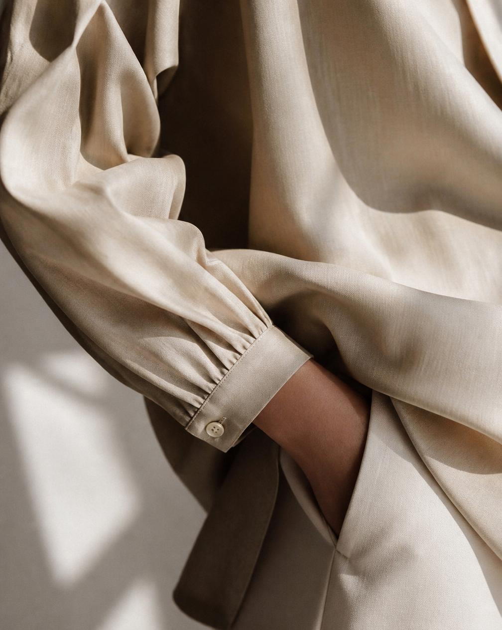 Close detail of soft draped fabric on a Myra blouse